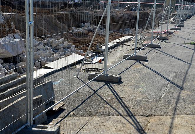 a metal temporary fence designed to keep out intruders from the job site